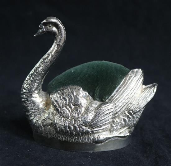 A large Edwardian novelty silver pin cushion modelled as a swan by Grey & Co, height 8.5cm.